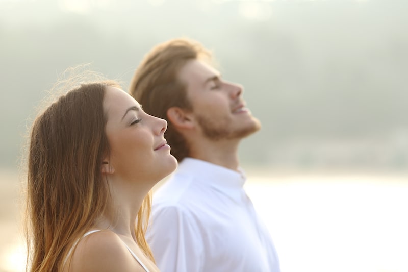 Two people breathing deeply.